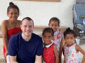 Michael Jones with children in Tonga